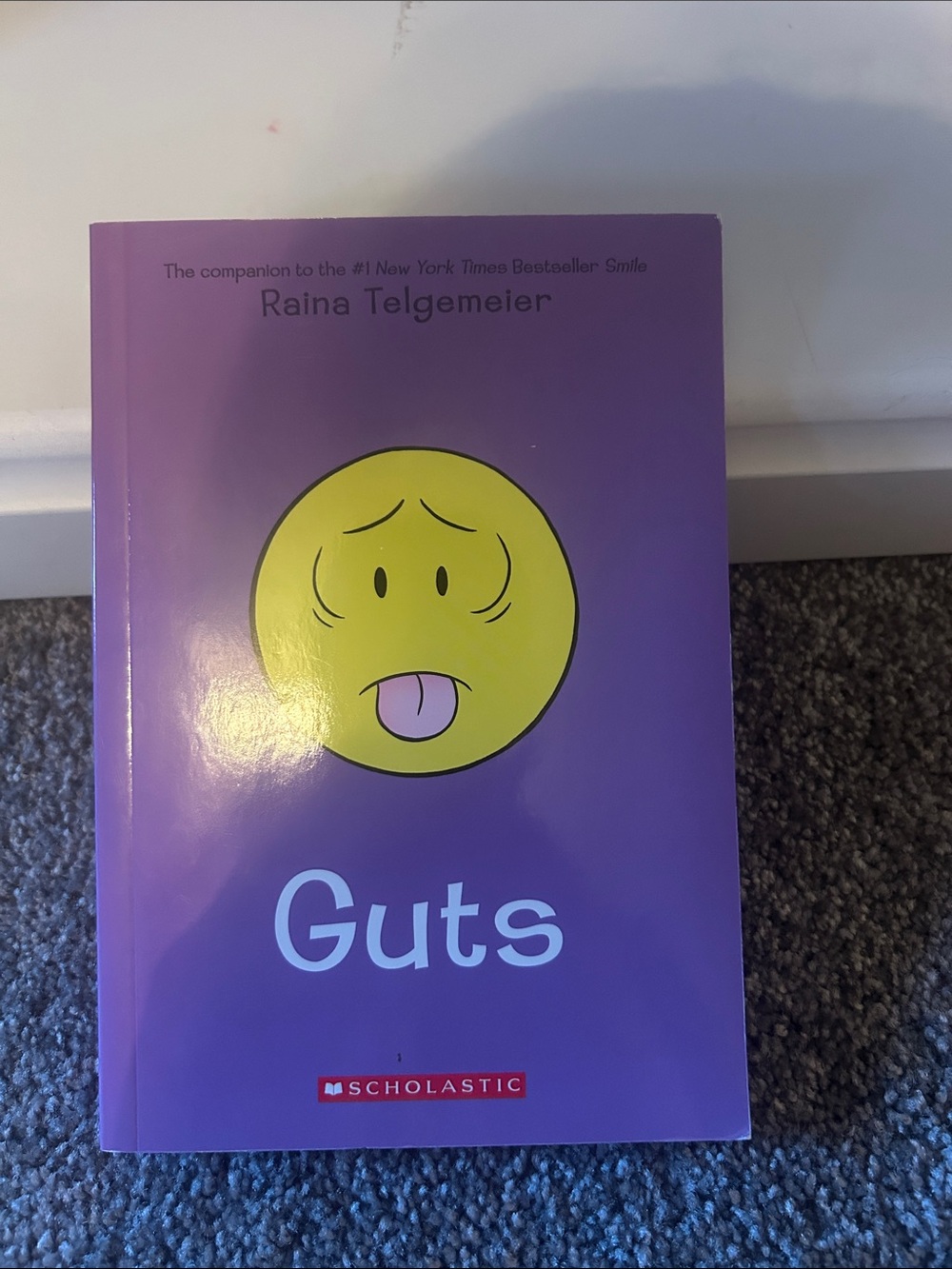 Scholastic Purple Cover with Yellow Emoticon — Guts